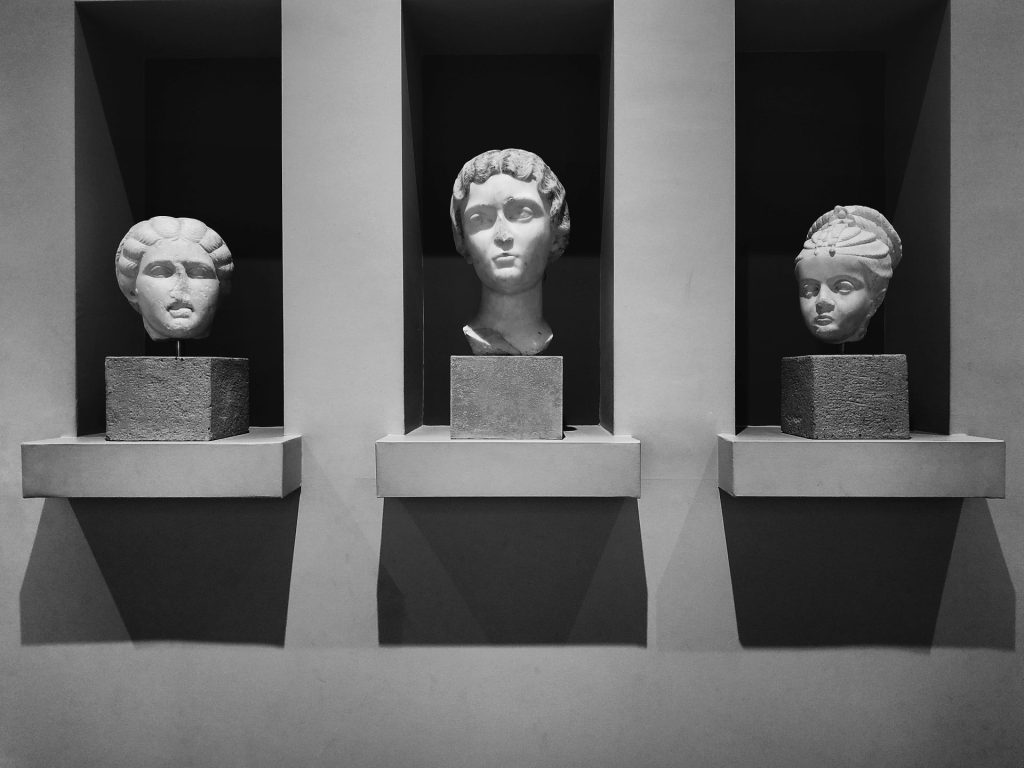 white concrete statue of man