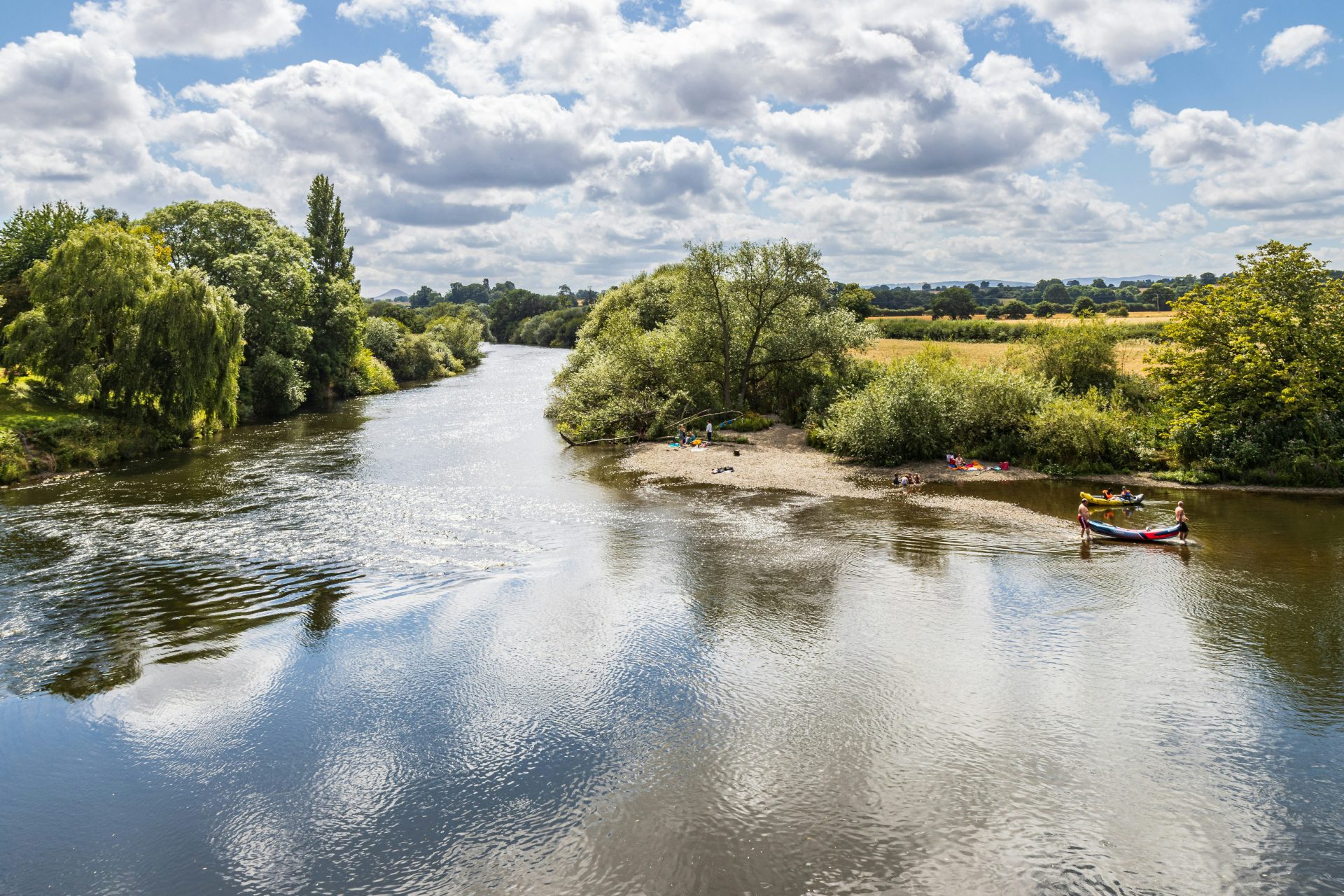 a group of people on boats in a river